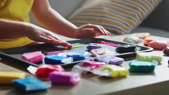 Child Is Sculpting From Plasticine alt