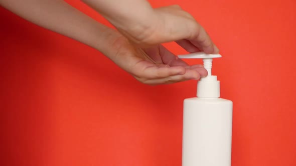 The child washes his hands theme. Close-up of children's hands are washed with liquid soa alt