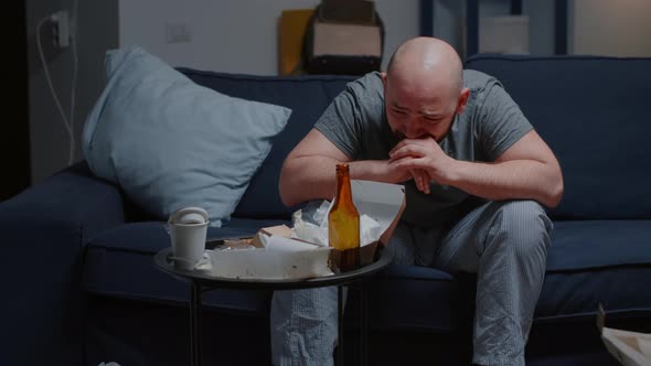 Breakdown Depressed Worried Hopeless Man with Tears Sitting on Couch alt