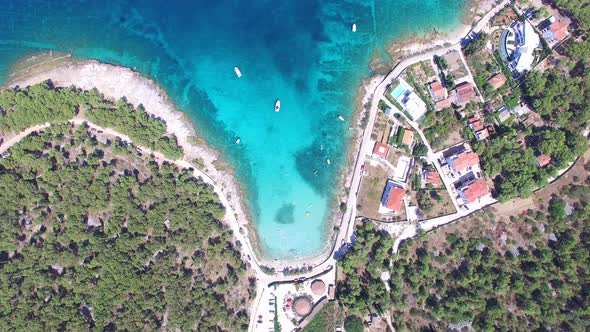 Aerial view of people swimming in turquoise water of the island of Brac, Croatia alt