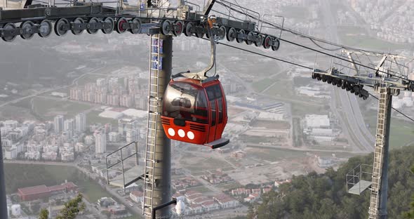 Cabin Descends Cable Car with Beautiful Cityscape alt