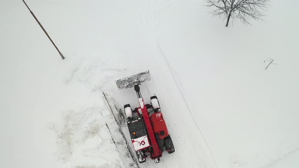 Snow clearing. Tractor clears the way after heavy snowfall.