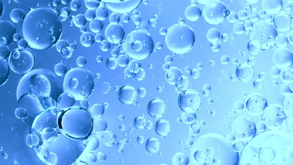 Super Slow Motion Shot of Moving Gel Bubbles on Light Blue Background at 1000Fps alt