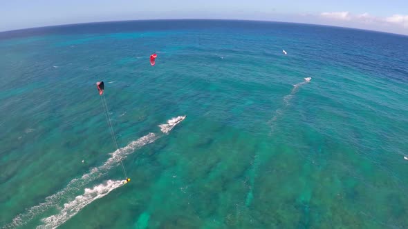Aerial view of a man kitesurfing in Hawaii alt
