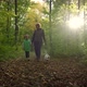 Woman with Little Daughter Walking the Dog in the Forest - VideoHive Item for Sale