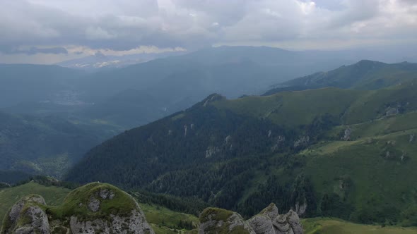 Reveal shot with beautiful mountain formations in the Ciucas mountains alt