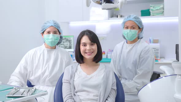 Caucasian girl patient smiling, sitting on dental chair waiting for medical service from dentist. alt