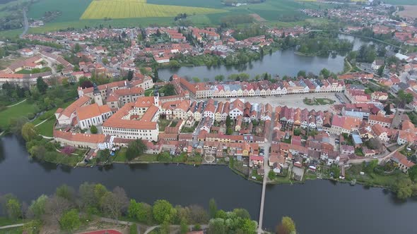 Aerial View of Buildings with Red Tile Roofs on Medieval Square and Old Castle Telc, Czech Republic alt