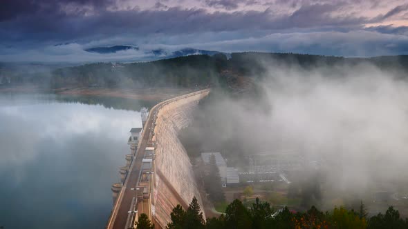 Morning Fog over Dam on Embalse de Aguilar de Campoo, Spain.