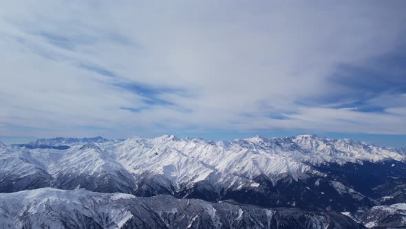Winter drone flight over Mestia`s mountains in gerorgia. Tetnuldi Ski Resort next to Tetnuldi Peak alt