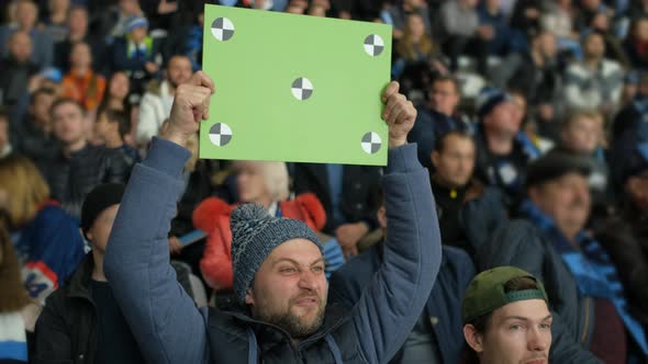 Crowd of People. Man Stadium Area Poster Hold Hands Custom Message Close Up . alt