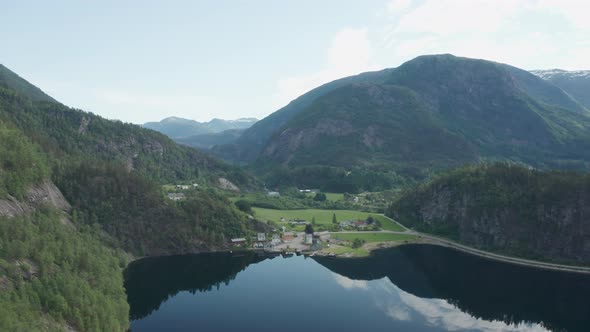 Distant aerial overview of village Eidslandet in Vaksdal with no people left alt