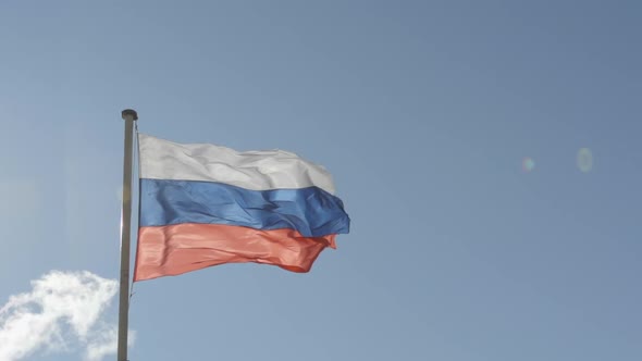 State flag of Russian Federation on blue sky background