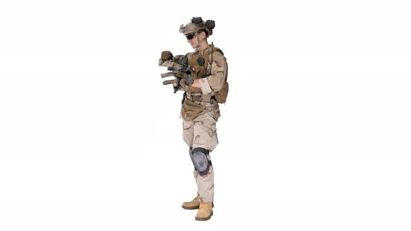 Soldier in Camouflage Gear Checking His Uniform on White Background alt