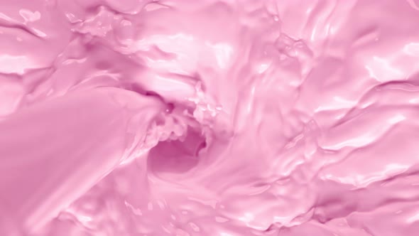 Super Slow Motion Shot of Pouring Pink Milk Into Wortex at 1000Fps. alt