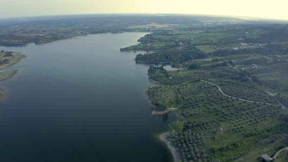 Aerial View Over A Mountain Dam In Portugal With some reflexions on water Before Sunrise alt