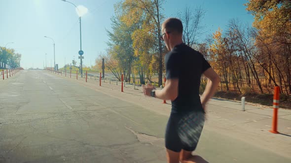 Triathlete Running, Sprinting And Endurance Workout Training. Marathon Runner Jog On Park. alt