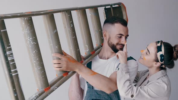 First Time Homeowners Moving and Folding Down Ladder alt