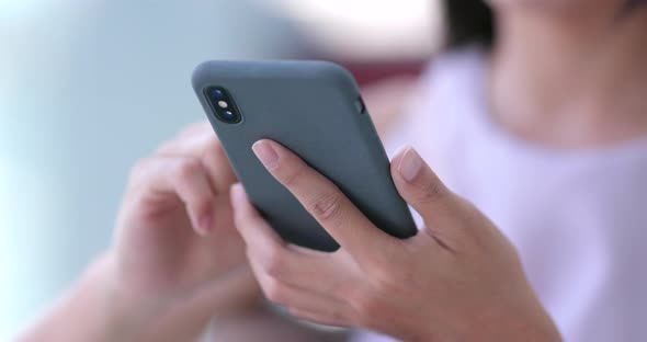 Close up Woman use of mobile phone alt