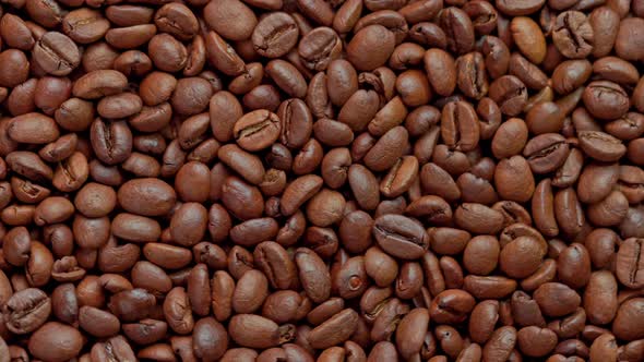 Full Frame Looped Spinning Background of Roasted Coffee Beans alt