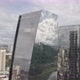 Close Mirrored two Building and Clouds with cars and river drone 4k - VideoHive Item for Sale