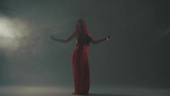Woman Dancing in Smoke in Red Dress alt