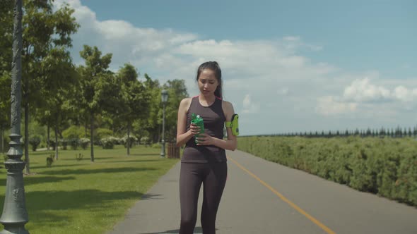 Fit Woman Drinking Energy Drink After Hard Workout alt