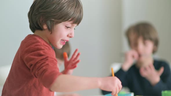 Kid Painting at Kindergarten alt