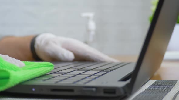 Male Person's Use Wet Napkin or Wipe Cleans Laptop Keyboard