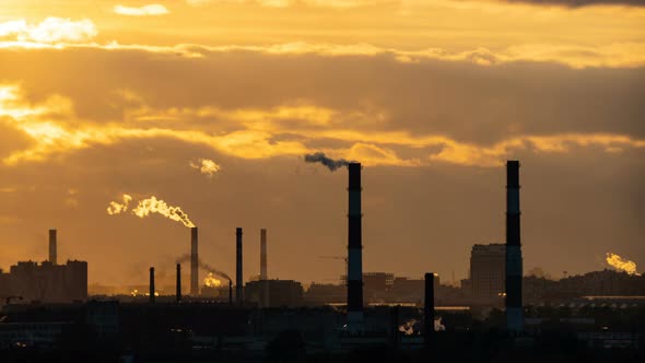 The Smoke From the Chimneys at Sunset