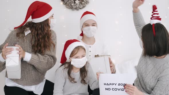 Festive Family in Party Hats and Masks Celebrating New Year alt