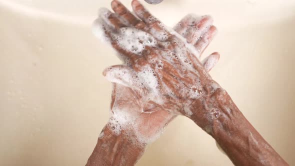 Senior Women Washing Hands with Soap Warm Water alt