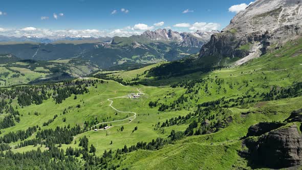 Dolomites mountains peaks with a hiking path on a summer day alt