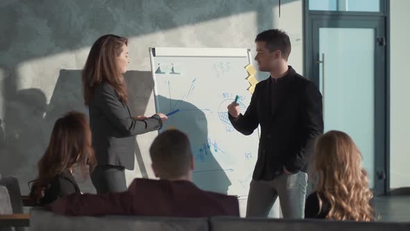 Diverse Group of Casual Businesspersons During Presentation of Project and Talking About Financial alt