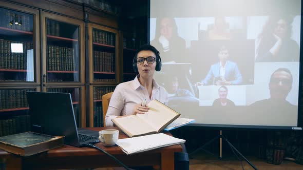 Librarian Is Teaching Video Lesson To Adults alt