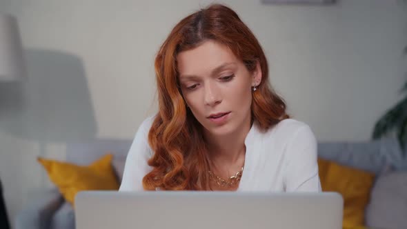 Thoughtful Female Make Difficult Decision Lost in Thought Reflecting with Laptop alt