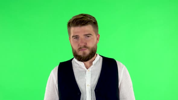 Man Is Offended and Looks Away. Green Screen alt
