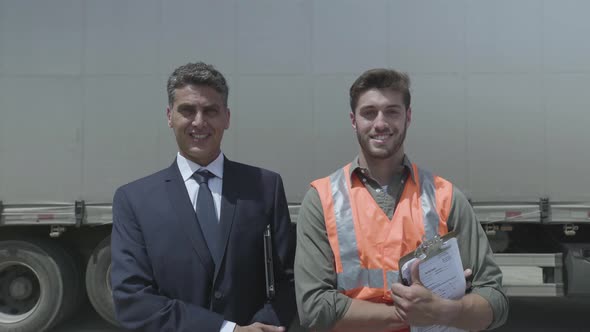 Worker and businessman smiling alt