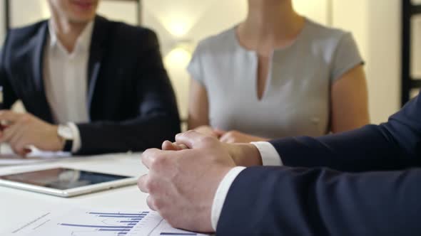 Employees Listening to Director and Smiling alt
