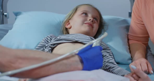 Doctor Examining Girls Abdomen with Ultrasound alt