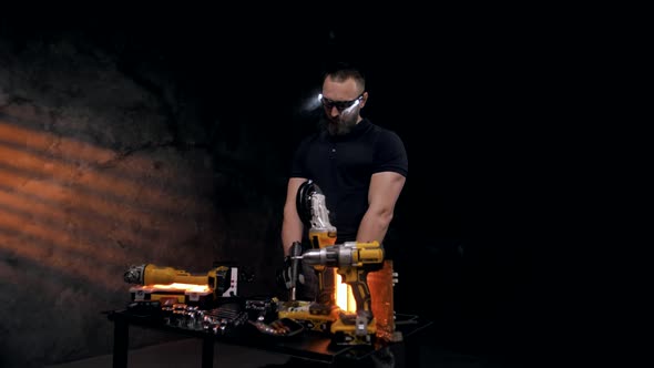 Professional technician working at a workbench with tools