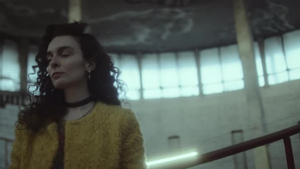 Young Lady on Staircase in Abandoned Building alt