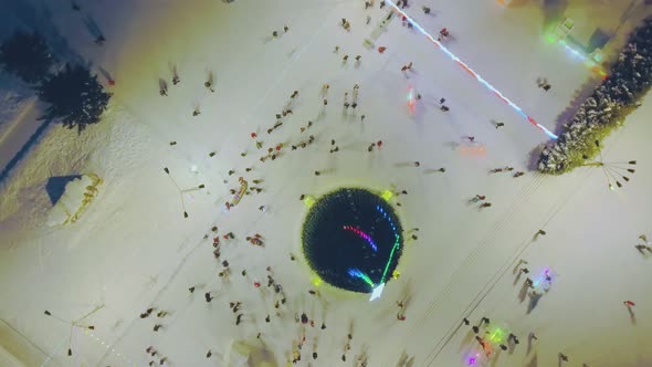 Christmas Tree and Walking People on City Square Aerial View alt