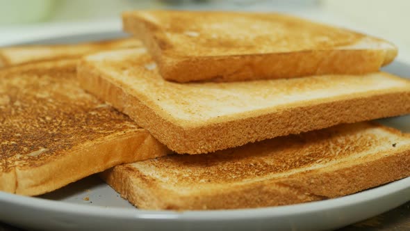 Crispy Golden White Bread Toasts in a Bowl Closeup
