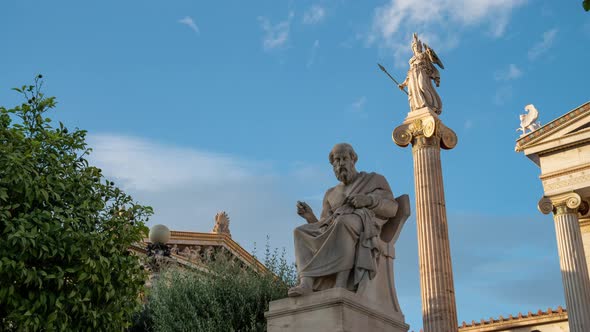 Statues of Plato and Athena time lapse in Academy of Athens during sunset alt