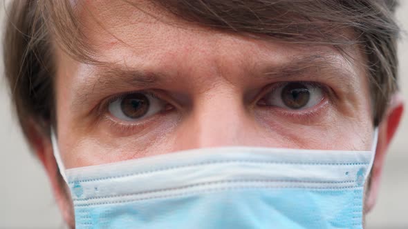 Close-up Cropped Portrait View of a Caucasian Man Wearing a Face Mask During Covid-19 Coronavirus