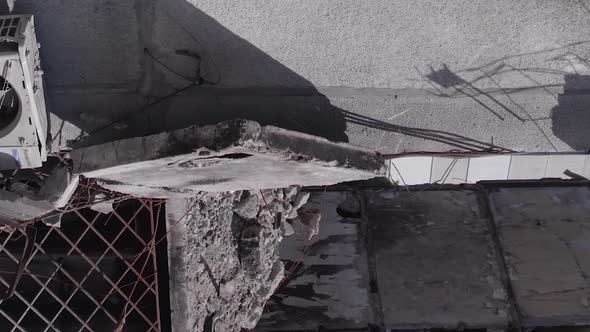 Vertical Video of the Consequences of the War in Ukraine  a Destroyed Building alt