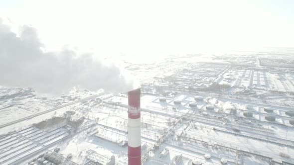 Smoking Chimney Of A Factory In Winter alt