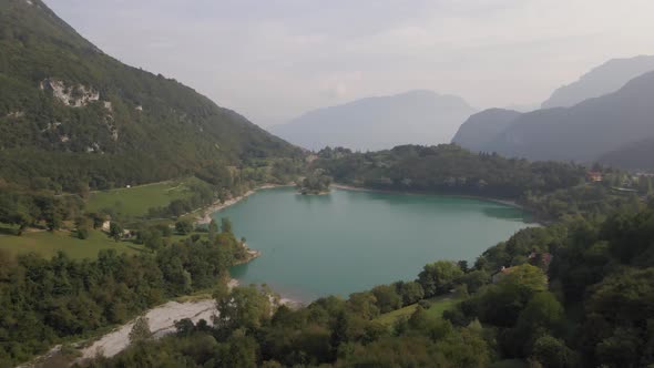 Aerial view in 4k of Tenno Lake, Trentino, Italy. alt