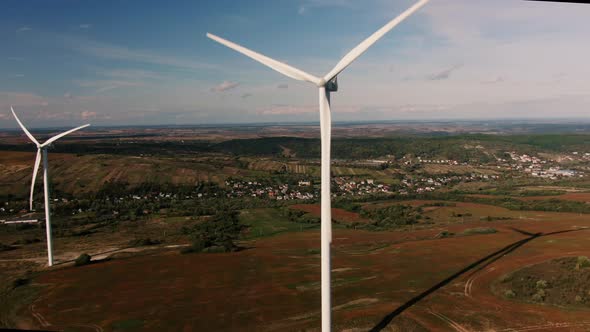 Camera Flight Over Landscape with Power Plant. Aerial View To Wind Turbine. Sustainable Electricity alt